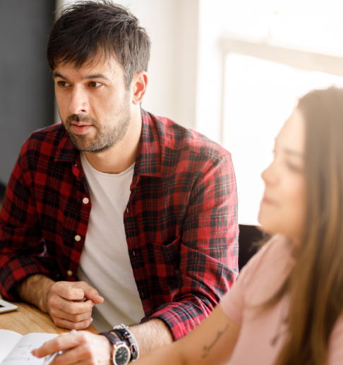 Man in a meeting with other professionals