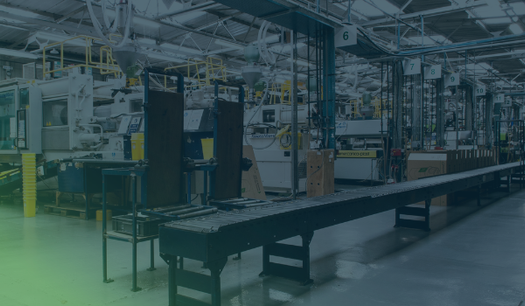 Defense manufacturing floor with production line machinery, representing CMMC Level 2 deadline pressure on DIB suppliers