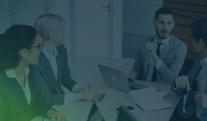 Business professionals in a boardroom discussion, representing strategic cybersecurity partnership for growing companies