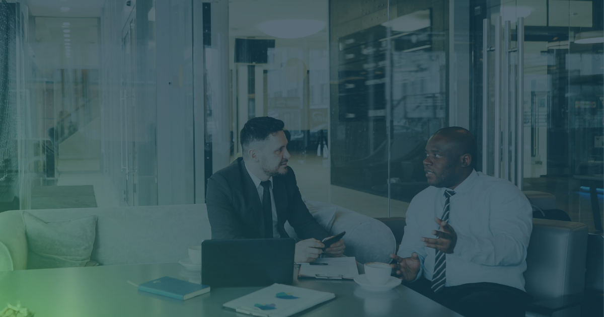 MSP owner discusses choosing a SOC partner with a technology partner over a laptop